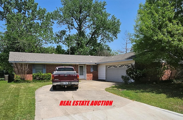 single story home featuring brick siding, a front lawn, driveway, and an attached garage