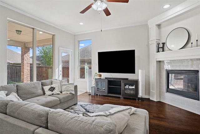 1811 Morning Mist Way, Wylie, TX 75098 - living area featuring ceiling fan, wood finished floors, crown molding, recessed lighting, and a glass covered fireplace