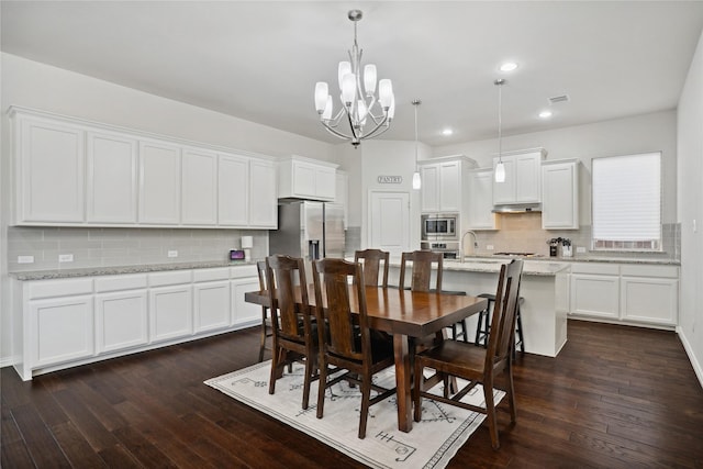 1811 Morning Mist Way, Wylie, TX 75098 - dining space featuring a chandelier, dark wood-style floors, and recessed lighting