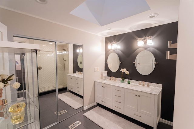 1711 Tamarack Dr, Dallas, TX 75228 - bathroom featuring crown molding, double vanity, a shower stall, and baseboards
