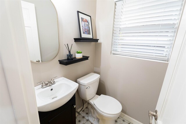 1711 Tamarack Dr, Dallas, TX 75228 - bathroom with vanity, toilet, and baseboards
