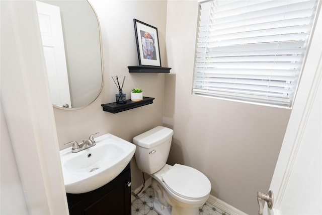 1711 Tamarack Dr, Dallas, TX 75228 - bathroom featuring vanity, toilet, and baseboards