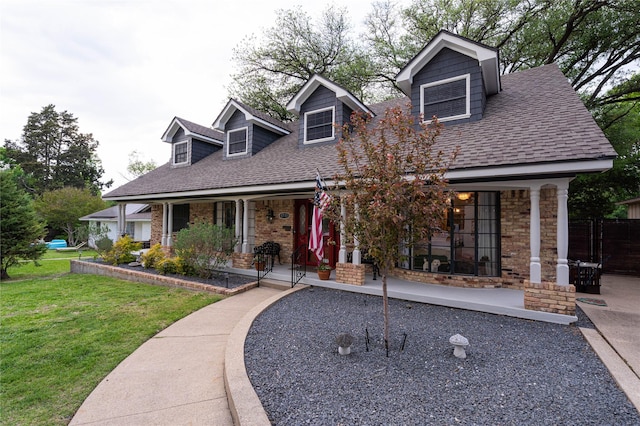 1711 Tamarack Dr, Dallas, TX 75228 - cape cod home featuring roof with shingles, a front yard, a porch, and brick siding