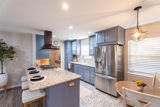 1711 Tamarack Dr, Dallas, TX 75228 - kitchen with appliances with stainless steel finishes, island exhaust hood, a sink, a peninsula, and glass insert cabinets