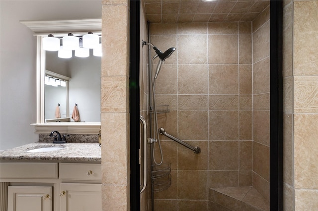 bathroom with vanity and a stall shower