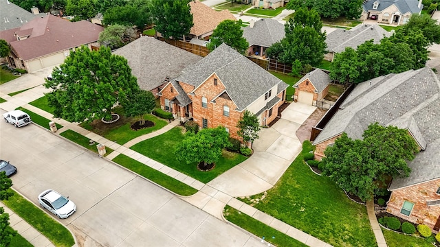 birds eye view of property with a residential view