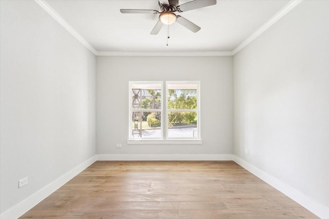 spare room featuring light wood-style flooring, baseboards, ornamental molding, and ceiling fan