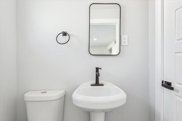bathroom with a sink and toilet