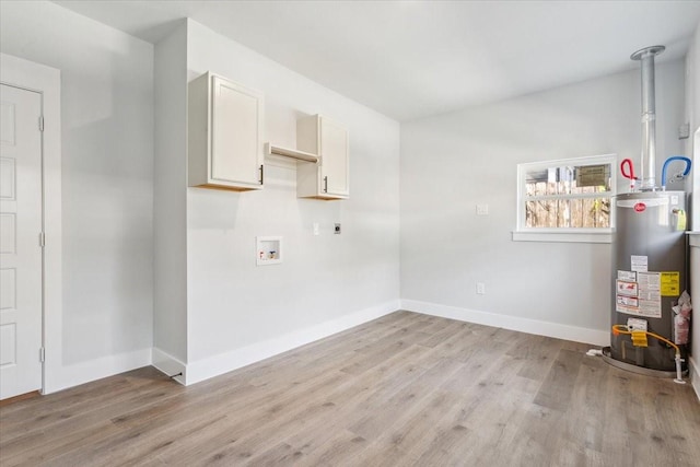 laundry room with water heater, light wood-style flooring, hookup for an electric dryer, and washer hookup