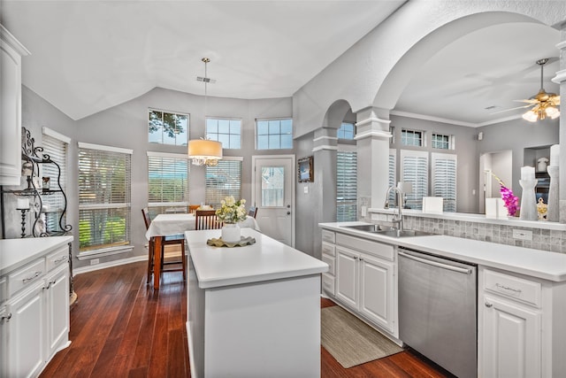 4009 Fairfax Ct, Flower Mound, TX 75028 - kitchen with dishwasher, a sink, a kitchen island, arched walkways, and ceiling fan