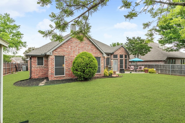 4009 Fairfax Ct, Flower Mound, TX 75028 - rear view of property featuring brick siding, a patio area, a chimney, and a shingled roof