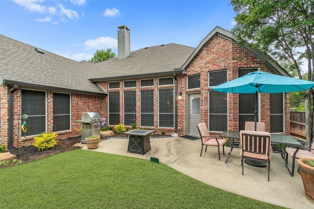 4009 Fairfax Ct, Flower Mound, TX 75028 - rear view of house with brick siding, a shingled roof, and a patio area