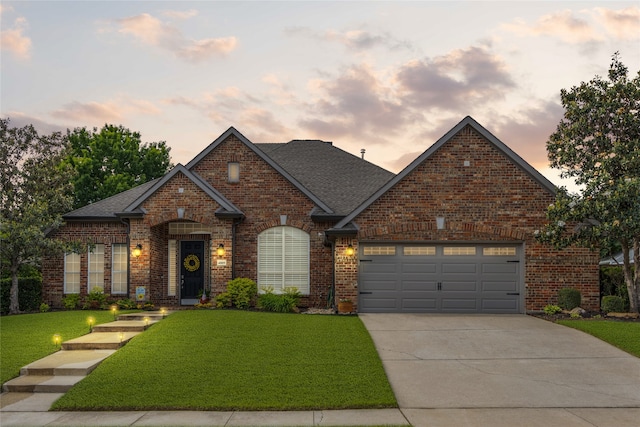 4009 Fairfax Ct, Flower Mound, TX 75028 - view of front facade with a lawn, brick siding, concrete driveway, an attached garage, and a shingled roof