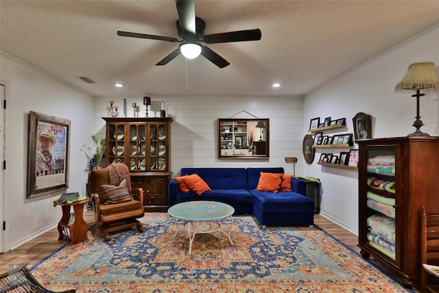 1929 S 13th St, Abilene, TX 79602 - living area featuring visible vents, a textured ceiling, a ceiling fan, and wood finished floors
