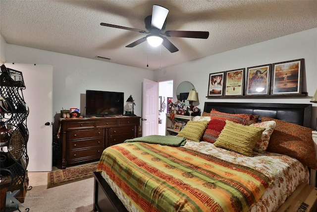 1929 S 13th St, Abilene, TX 79602 - bedroom featuring visible vents, ceiling fan, carpet, and a textured ceiling