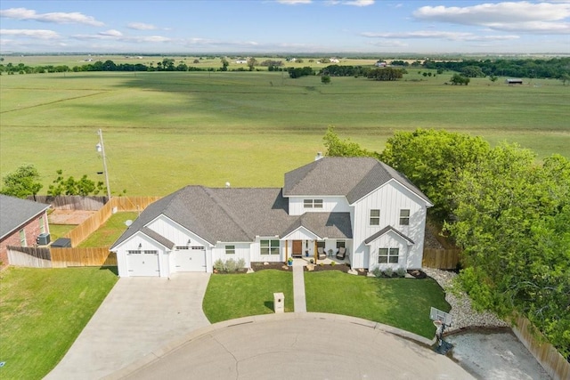 birds eye view of property featuring a rural view