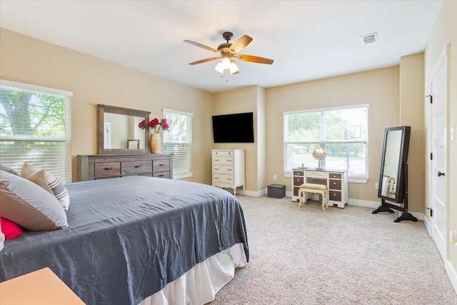 bedroom featuring baseboards, ceiling fan, carpet, and visible vents