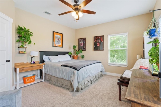 bedroom featuring carpet floors, baseboards, a ceiling fan, and visible vents