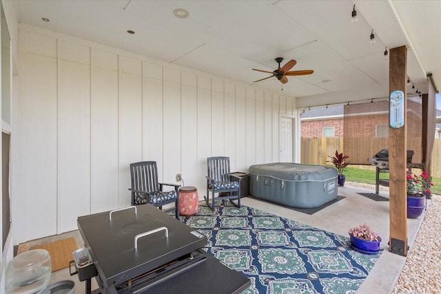 view of patio / terrace with a ceiling fan and fence