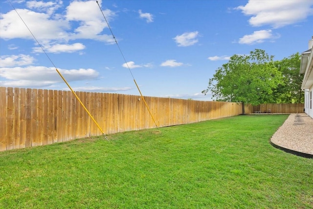 view of yard with a fenced backyard