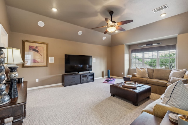 living area with ceiling fan, baseboards, visible vents, and carpet