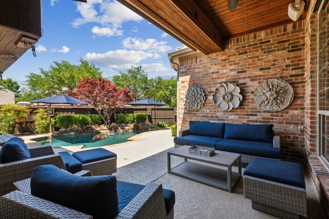 view of patio with an outdoor hangout area, a fenced in pool, and a fenced backyard