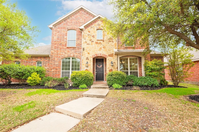 7014 Handen Dr, Rowlett, TX 75089 - view of front of property with a front lawn, stone siding, brick siding, and a shingled roof
