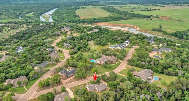 birds eye view of property with a rural view