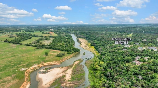 birds eye view of property featuring a wooded view