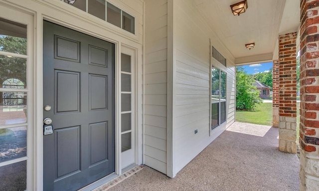doorway to property featuring a porch