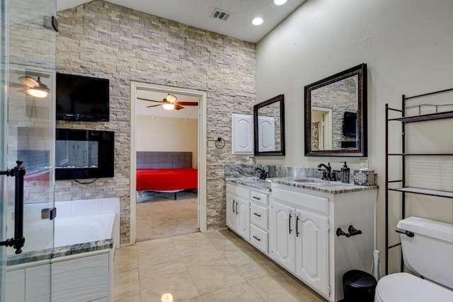 ensuite bathroom featuring ceiling fan, toilet, ensuite bathroom, a sink, and visible vents