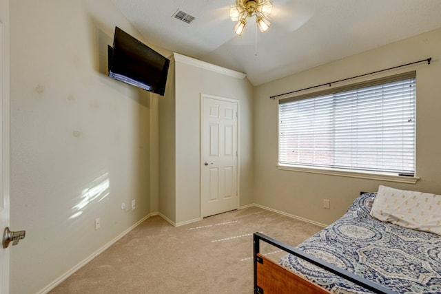 bedroom with visible vents, ceiling fan, light colored carpet, and baseboards
