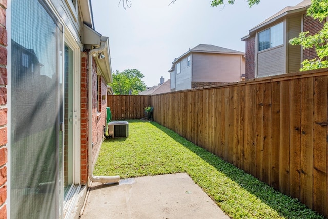 view of yard with cooling unit, a patio, and a fenced backyard