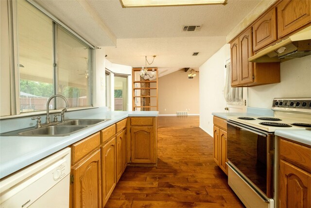 kitchen featuring visible vents, range with electric stovetop, dark wood-style floors, a sink, and dishwasher