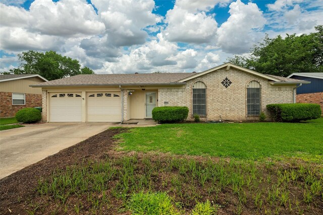 single story home featuring concrete driveway, brick siding, an attached garage, and a front yard