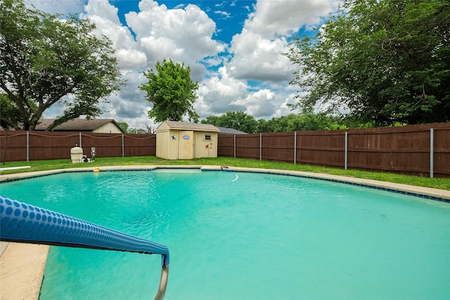 view of pool with an outdoor structure, a fenced backyard, a fenced in pool, a lawn, and a storage shed
