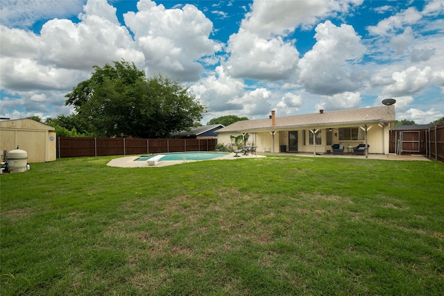 view of yard with a patio, a fenced in pool, and a fenced backyard
