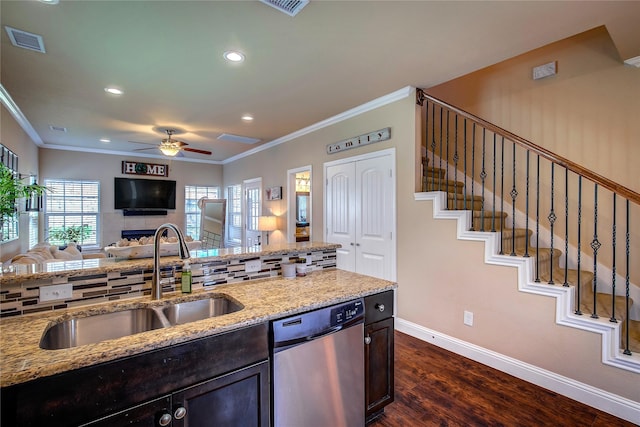 kitchen with ceiling fan, stainless steel dishwasher, ornamental molding, visible vents, and a sink