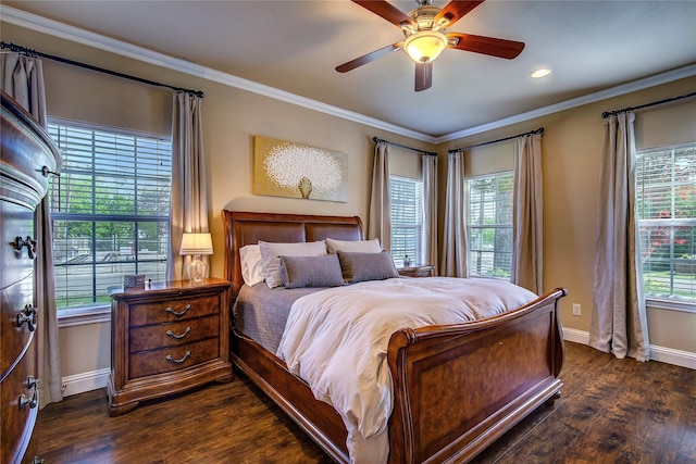 bedroom with crown molding, dark wood-style flooring, baseboards, and multiple windows