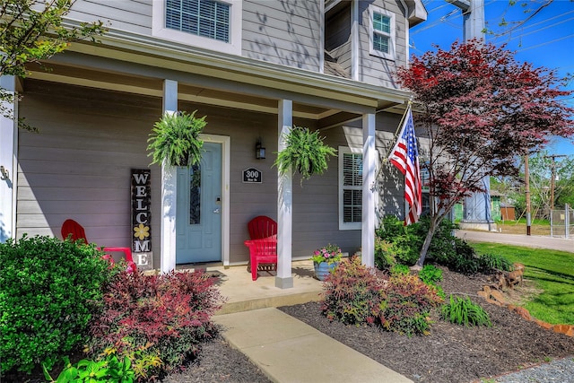 doorway to property with covered porch