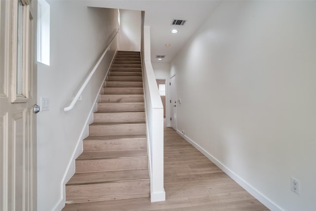 3251 Cambrick St Unit 13, Dallas, TX 75204 - stairway with baseboards, wood finished floors, visible vents, and recessed lighting
