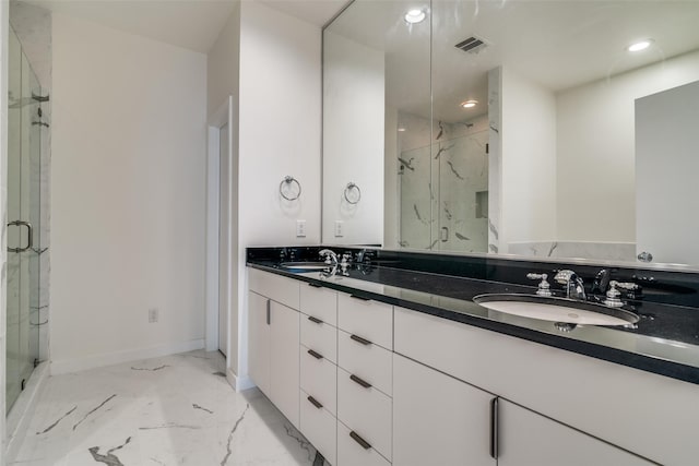 3251 Cambrick St Unit 13, Dallas, TX 75204 - bathroom with visible vents, marble finish floor, a marble finish shower, and a sink