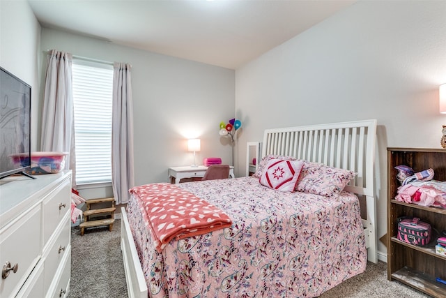 bedroom with carpet flooring and multiple windows