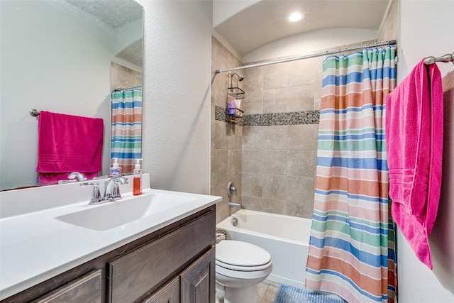 full bathroom featuring shower / tub combo with curtain, toilet, and vanity