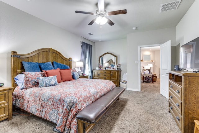carpeted bedroom featuring baseboards, visible vents, and ceiling fan