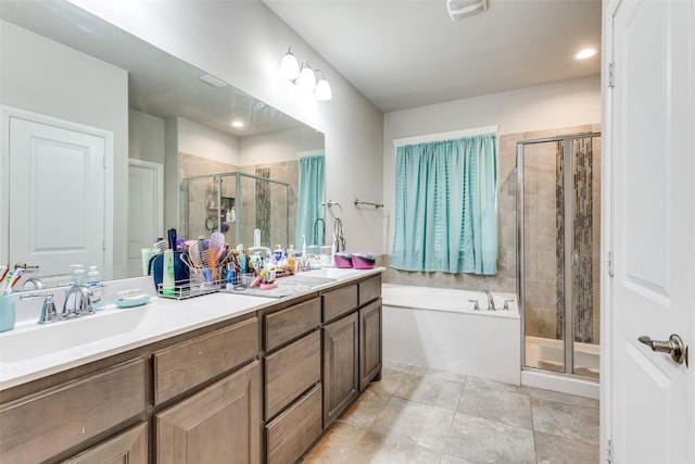 bathroom with a shower stall, a sink, a bath, double vanity, and visible vents