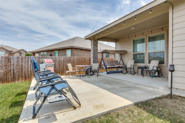 view of patio featuring fence