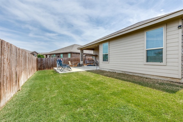 view of yard with a fenced backyard and a patio