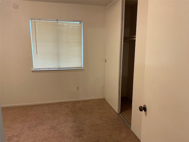 5607 Harvest Hill Rd Unit 2008, Dallas, TX 75230 - unfurnished bedroom with a closet, carpet flooring, and baseboards
