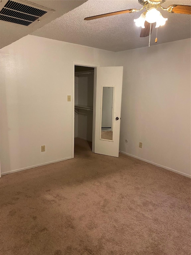5607 Harvest Hill Rd Unit 2008, Dallas, TX 75230 - unfurnished bedroom featuring ceiling fan, carpet, a textured ceiling, a closet, and visible vents